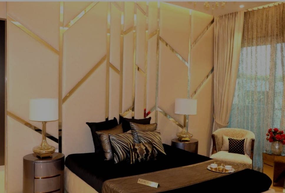 Master bedroom with gold accent wall in 4+1 BHK premium flat Zirakpur